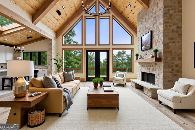 458 Palisade Dr Unit 2142, Ellijay, GA 30540 - living room featuring a chandelier, light wood finished floors, wooden ceiling with exposed beams, high vaulted ceiling, and a fireplace