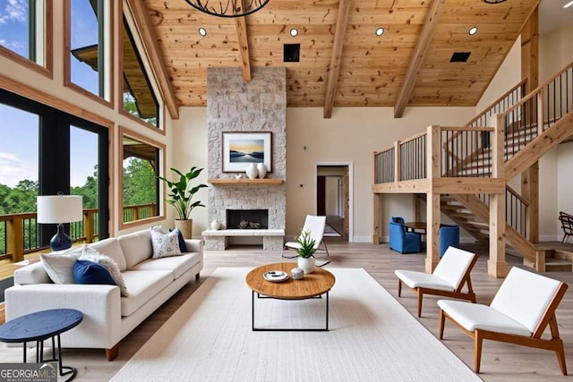 458 Palisade Dr Unit 2142, Ellijay, GA 30540 - living area featuring wood ceiling with exposed beams, high vaulted ceiling, wood finished floors, a fireplace, and stairway
