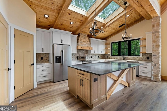 458 Palisade Dr Unit 2142, Ellijay, GA 30540 - kitchen featuring open shelves, a chandelier, appliances with stainless steel finishes, wall chimney range hood, and a skylight