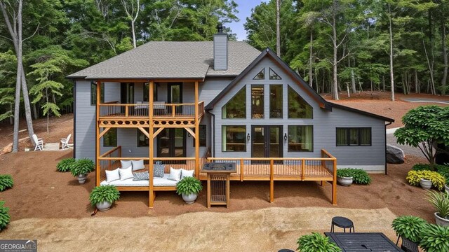 458 Palisade Dr Unit 2142, Ellijay, GA 30540 - back of property with a balcony, a wooden deck, french doors, a chimney, and an outdoor hangout area