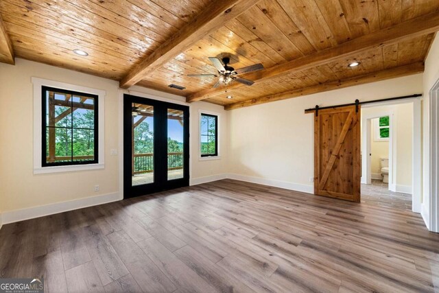 458 Palisade Dr Unit 2142, Ellijay, GA 30540 - spare room with wooden ceiling with exposed beams, a barn door, plenty of natural light, wood finished floors, and ceiling fan