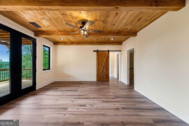 458 Palisade Dr Unit 2142, Ellijay, GA 30540 - empty room featuring wood ceiling with exposed beams, a barn door, french doors, ceiling fan, and wood finished floors