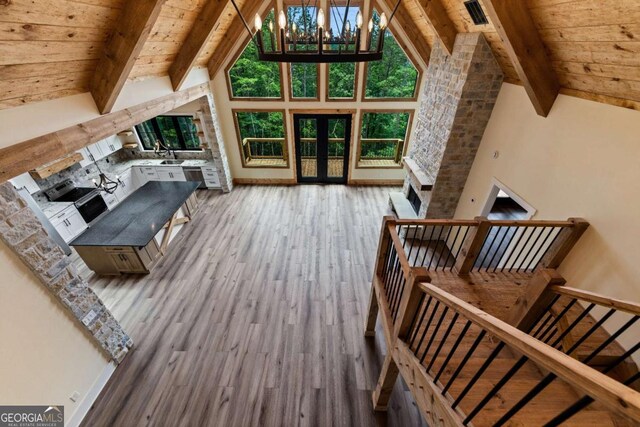 458 Palisade Dr Unit 2142, Ellijay, GA 30540 - living room featuring french doors, wood finished floors, high vaulted ceiling, wood ceiling with exposed beams, and a chandelier
