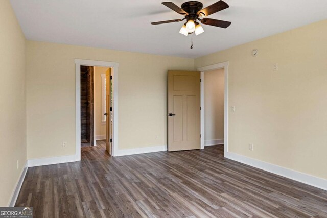 458 Palisade Dr Unit 2142, Ellijay, GA 30540 - unfurnished bedroom with dark wood-style flooring, baseboards, and a ceiling fan
