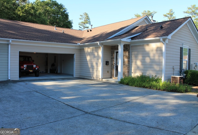 175 Camry Ln, Grayson, GA 30017 - ranch-style home featuring driveway, an attached garage, and roof with shingles