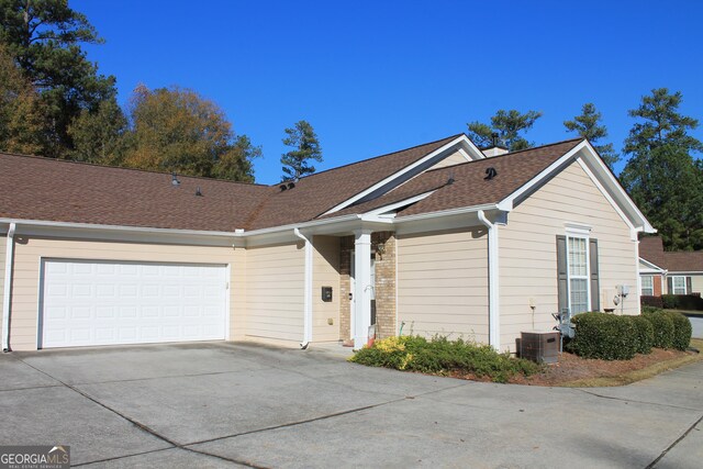 175 Camry Ln, Grayson, GA 30017 - ranch-style house featuring concrete driveway, a shingled roof, and a garage
