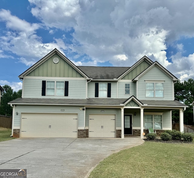 9108 Alden Dr, Locust Grove, GA 30248 - view of front of home featuring board and batten siding, an attached garage, and driveway