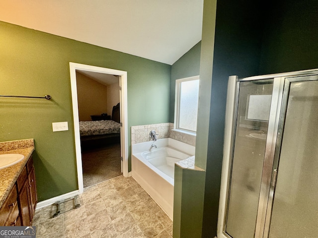9108 Alden Dr, Locust Grove, GA 30248 - ensuite bathroom with vanity, a stall shower, a bath, and vaulted ceiling