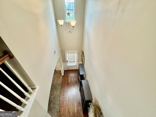 9108 Alden Dr, Locust Grove, GA 30248 - entryway featuring dark wood-type flooring, a high ceiling, a chandelier, and stairway