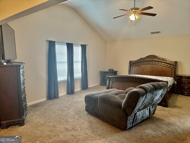 9108 Alden Dr, Locust Grove, GA 30248 - bedroom featuring carpet flooring, vaulted ceiling, a ceiling fan, and a wood stove