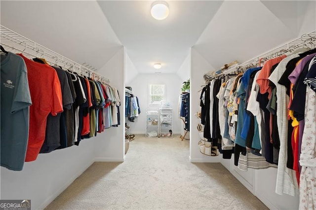 4108 Wyndam Hill Dr, Suwanee, GA 30024 - walk in closet featuring vaulted ceiling and carpet flooring
