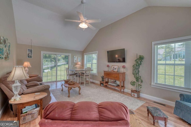 2008 Hidden Valley Rd, Hiawassee, GA 30546 - living area featuring wood finished floors, plenty of natural light, a ceiling fan, baseboards, and high vaulted ceiling