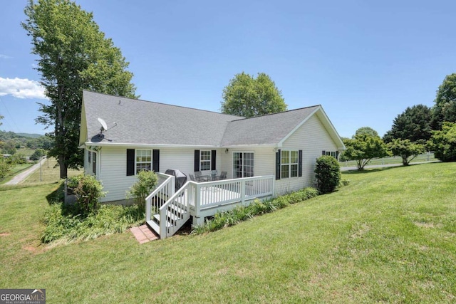 2008 Hidden Valley Rd, Hiawassee, GA 30546 - view of front facade featuring a front yard, a wooden deck, and roof with shingles