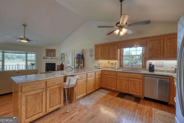 2008 Hidden Valley Rd, Hiawassee, GA 30546 - kitchen with stainless steel dishwasher, ceiling fan, a sink, a peninsula, and lofted ceiling