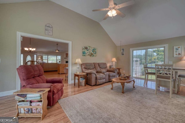 2008 Hidden Valley Rd, Hiawassee, GA 30546 - living room featuring a ceiling fan, high vaulted ceiling, healthy amount of natural light, wood finished floors, and a chandelier