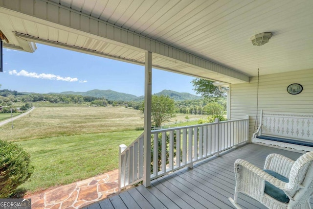 2008 Hidden Valley Rd, Hiawassee, GA 30546 - porch featuring a mountain view, a lawn, and a view of countryside
