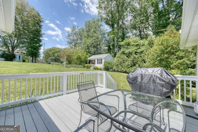 2008 Hidden Valley Rd, Hiawassee, GA 30546 - wooden terrace with a lawn, outdoor dining space, an outdoor structure, and view of wooded area