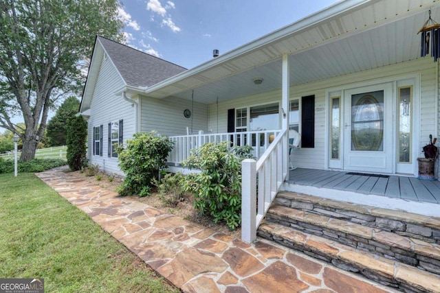 2008 Hidden Valley Rd, Hiawassee, GA 30546 - property entrance with a porch, roof with shingles, and a lawn