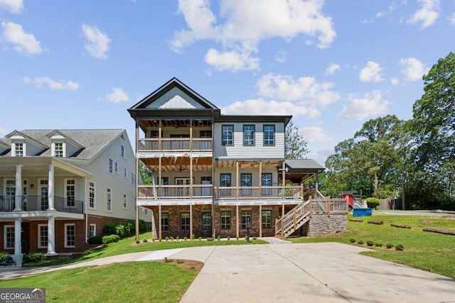 2153 Cooper Lake Rd SE, Smyrna, GA 30080 - rear view of house with a yard, a balcony, and brick siding