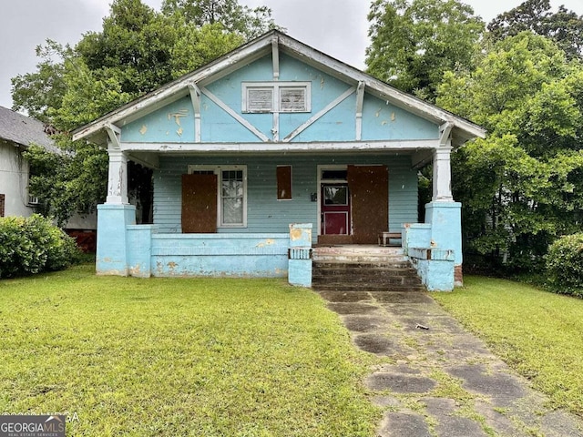 1058 Crescent Ave, Macon, GA 31204 - view of front of property featuring covered porch and a front lawn