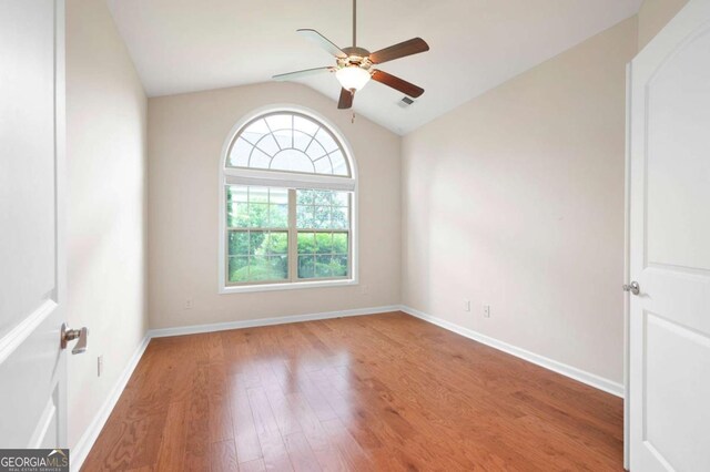 2061 Grove Field Ln, Marietta, GA 30064 - kitchen featuring a breakfast bar area, brown cabinets, light stone countertops, stainless steel microwave, and tasteful backsplash