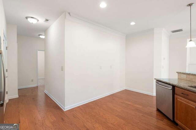 2061 Grove Field Ln, Marietta, GA 30064 - kitchen with stainless steel appliances, a sink, light wood-style flooring, decorative backsplash, and crown molding
