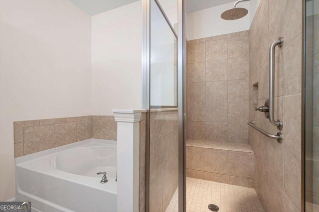 2061 Grove Field Ln, Marietta, GA 30064 - bathroom with a shower stall, double vanity, tile patterned flooring, a walk in closet, and a garden tub
