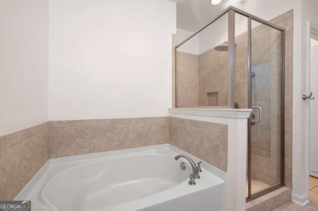 2061 Grove Field Ln, Marietta, GA 30064 - bathroom featuring a stall shower and a bath