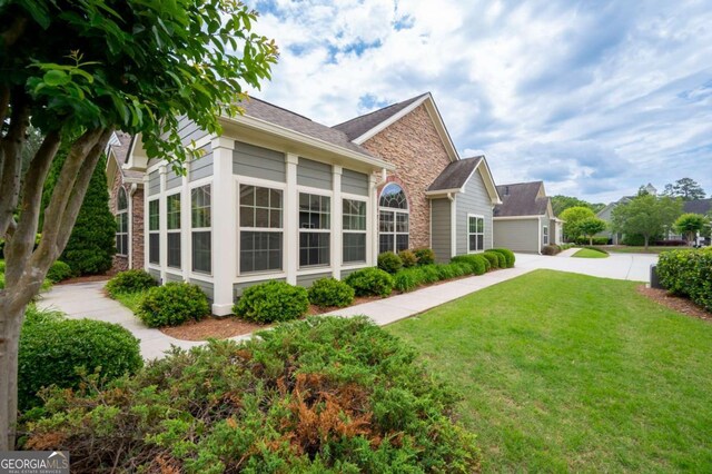2061 Grove Field Ln, Marietta, GA 30064 - view of front of house with concrete driveway, an attached garage, and a shingled roof