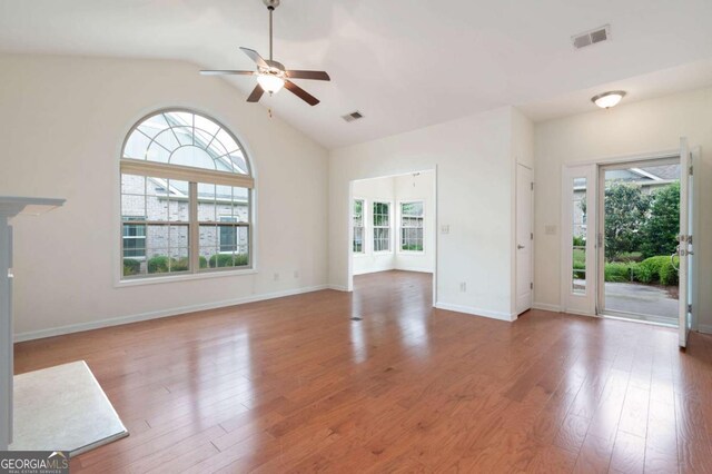 2061 Grove Field Ln, Marietta, GA 30064 - unfurnished living room featuring ceiling fan, light wood-style floors, a premium fireplace, baseboards, and lofted ceiling