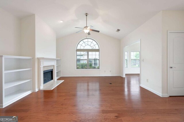 2061 Grove Field Ln, Marietta, GA 30064 - unfurnished living room featuring plenty of natural light, ceiling fan, wood finished floors, vaulted ceiling, and baseboards