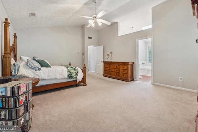 1679 Summit Place Way, Loganville, GA 30052 - bedroom with light colored carpet, high vaulted ceiling, baseboards, ensuite bath, and a textured ceiling