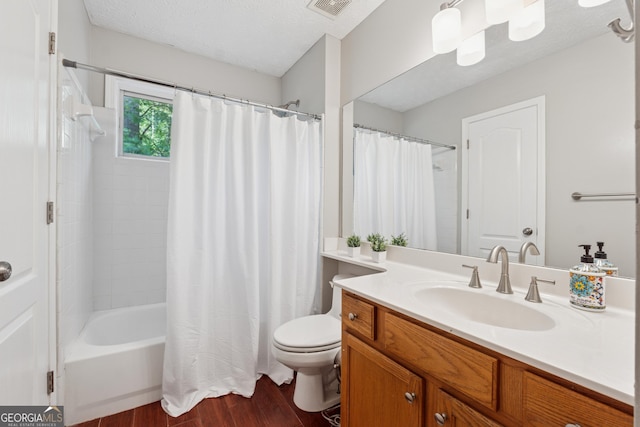 1679 Summit Place Way, Loganville, GA 30052 - full bathroom with wood finished floors, vanity, toilet, shower / tub combo, and a textured ceiling