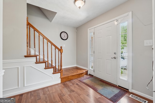 1679 Summit Place Way, Loganville, GA 30052 - foyer entrance with stairs and wood finished floors