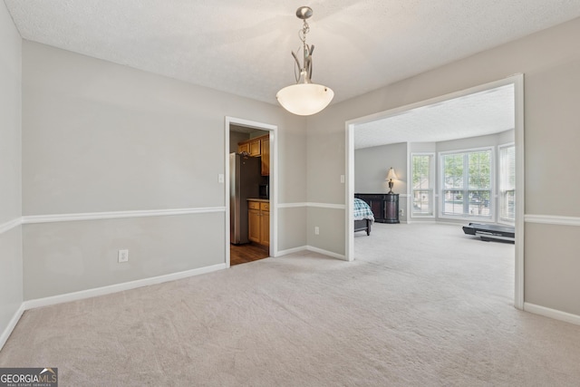 1679 Summit Place Way, Loganville, GA 30052 - carpeted empty room featuring baseboards and a textured ceiling