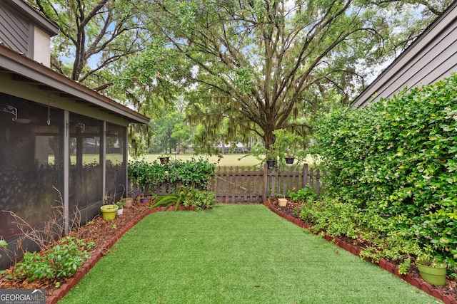 107 Linkside Dr, Saint Simons, GA 31522 - view of yard featuring a sunroom