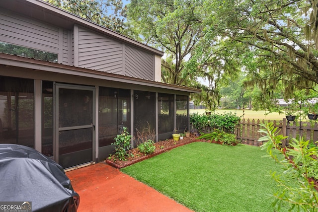 107 Linkside Dr, Saint Simons, GA 31522 - view of yard with a sunroom