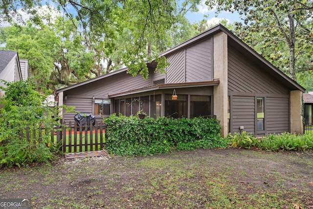 107 Linkside Dr, Saint Simons, GA 31522 - back of house with a sunroom