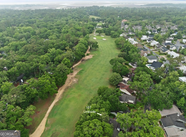 107 Linkside Dr, Saint Simons, GA 31522 - aerial overview of property's location featuring a golf course and nearby suburban area