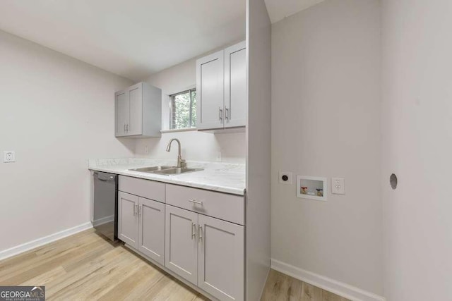 1111 Clairemont Ave Unit N3, Decatur, GA 30030 - laundry room with washer hookup, a sink, hookup for an electric dryer, baseboards, and light wood-type flooring