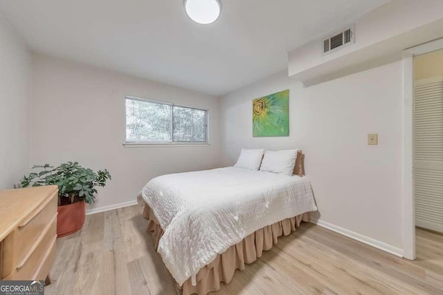 1111 Clairemont Ave Unit N3, Decatur, GA 30030 - bedroom with light wood-type flooring and baseboards