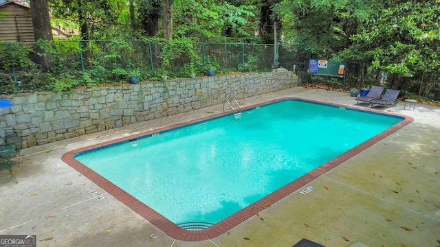 1111 Clairemont Ave Unit N3, Decatur, GA 30030 - community pool featuring a fenced backyard and a patio