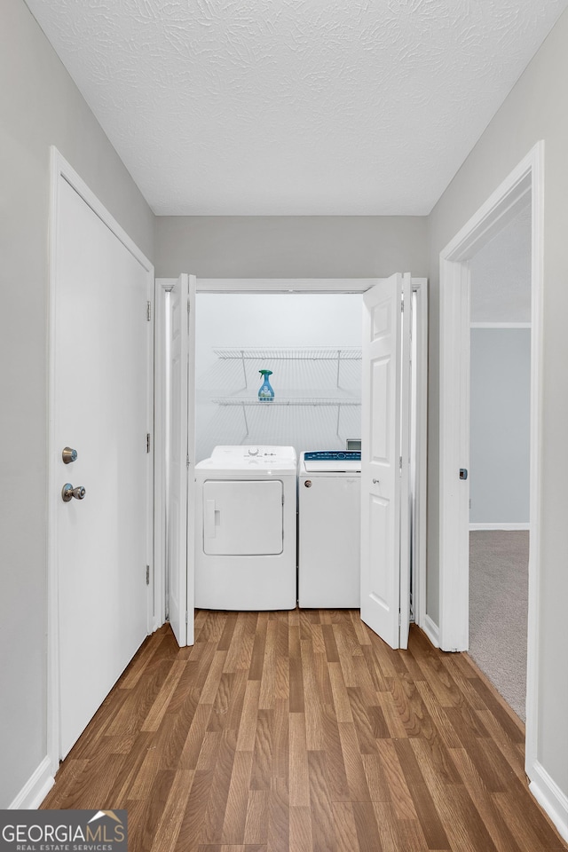 2786 Olde Gate Ct, Snellville, GA 30078 - laundry room featuring washer and clothes dryer and wood finished floors