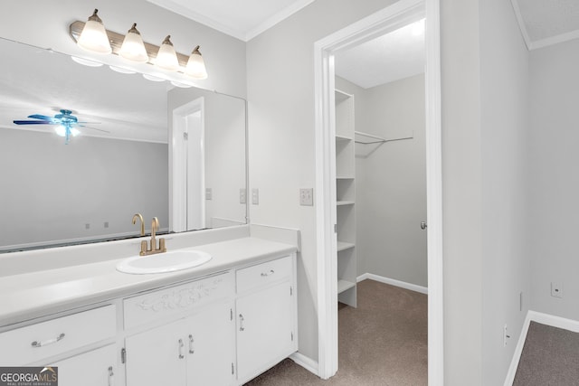 2786 Olde Gate Ct, Snellville, GA 30078 - bathroom with vanity, a ceiling fan, ornamental molding, baseboards, and a walk in closet