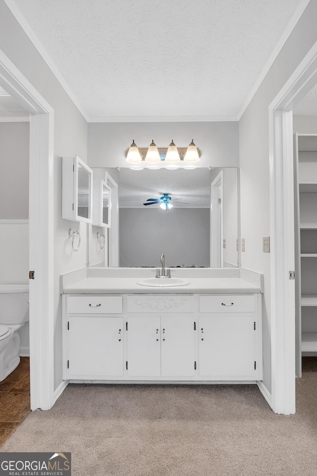 2786 Olde Gate Ct, Snellville, GA 30078 - bathroom featuring vanity, carpet floors, toilet, ornamental molding, and a textured ceiling
