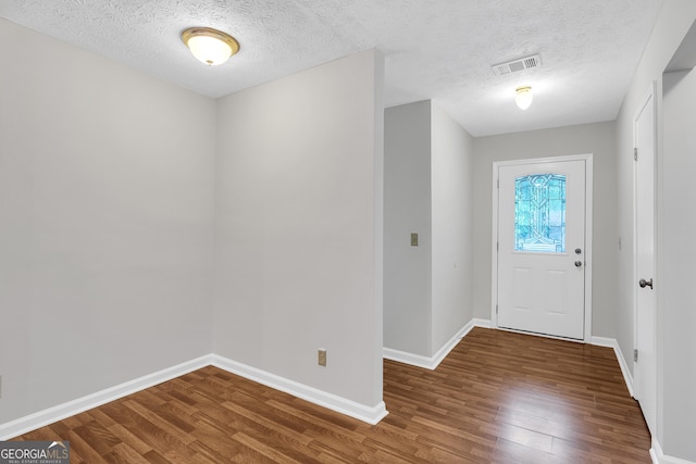 2786 Olde Gate Ct, Snellville, GA 30078 - entrance foyer with wood finished floors, baseboards, and a textured ceiling