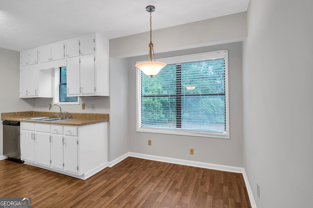 2786 Olde Gate Ct, Snellville, GA 30078 - kitchen featuring stainless steel dishwasher, dark wood-style floors, baseboards, white cabinetry, and a sink