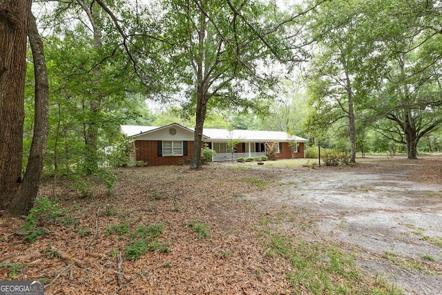 701 Log Landing Rd, Springfield, GA 31329 - view of front of house with brick siding and covered porch