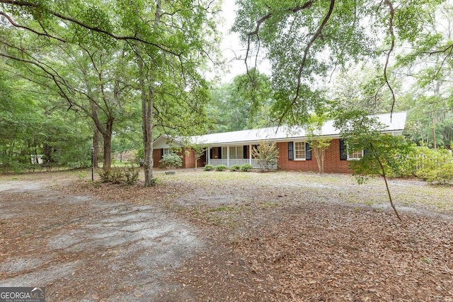 701 Log Landing Rd, Springfield, GA 31329 - ranch-style home featuring covered porch and brick siding
