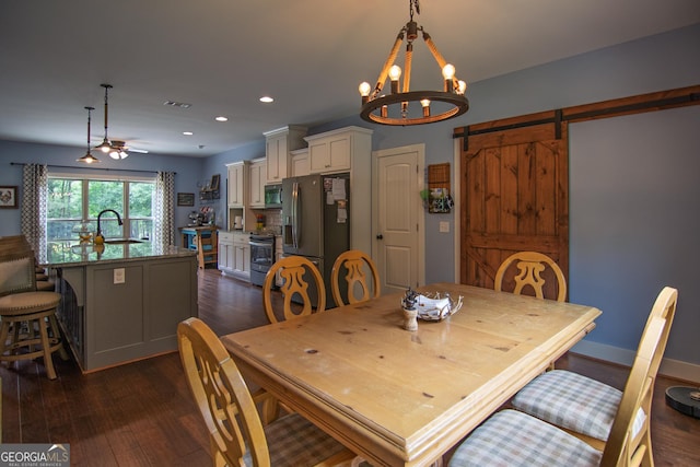 299 Savior Ln, Hamilton, GA 31811 - dining room with dark wood-style floors, a barn door, recessed lighting, a chandelier, and ceiling fan